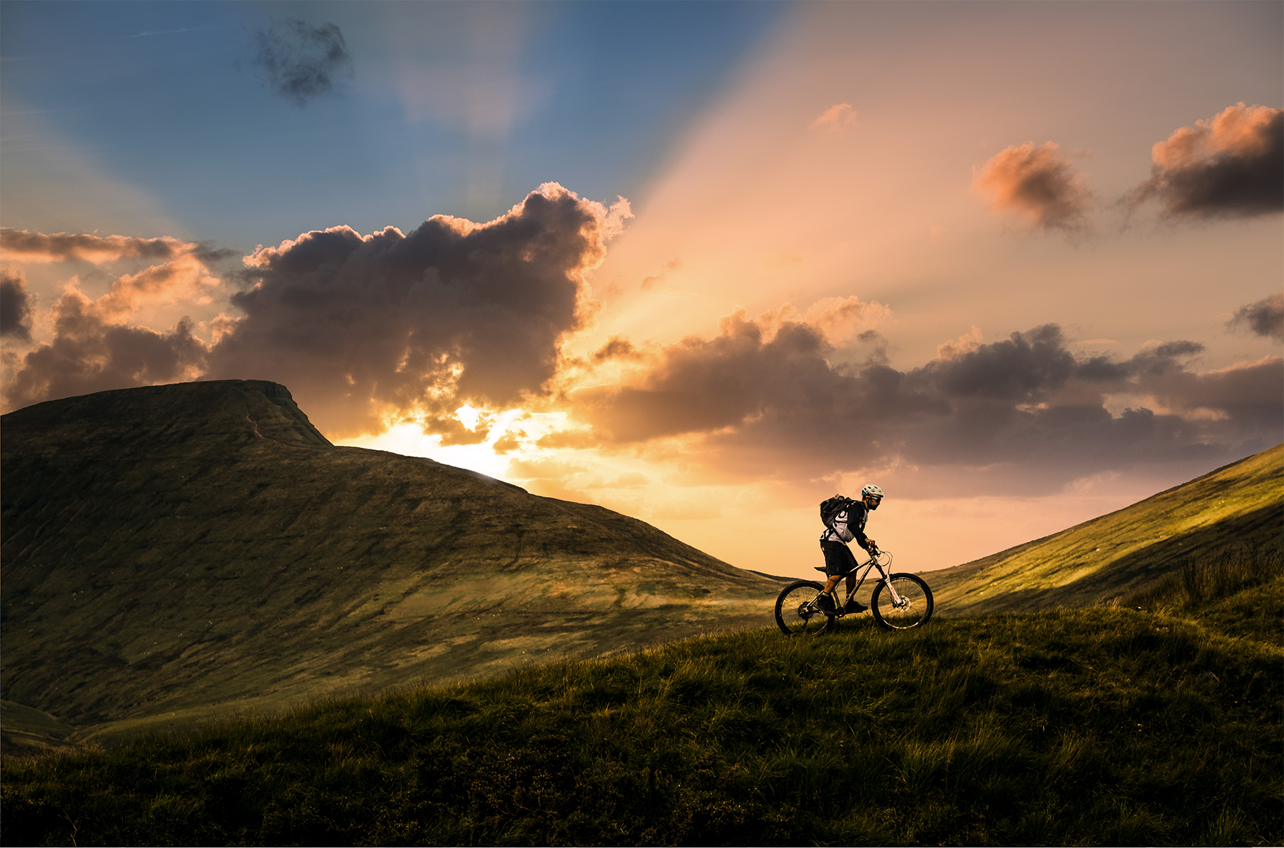 Mountain biker at sunset in the Brecon Beacons, Wales-1.png